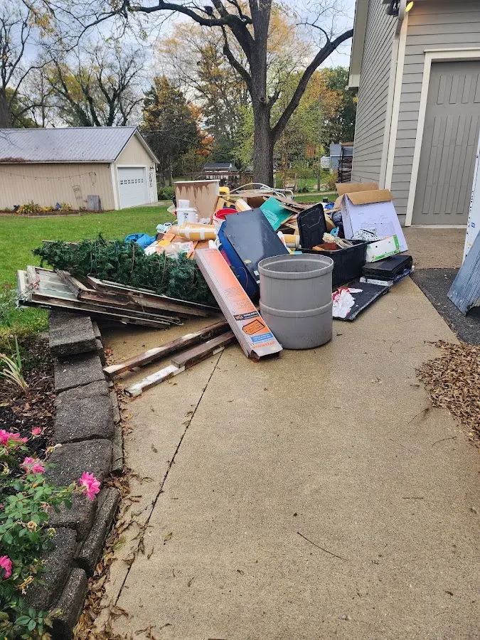 Dumpster being loaded with debris for 3 Yard Dumpster Rental in Oxford